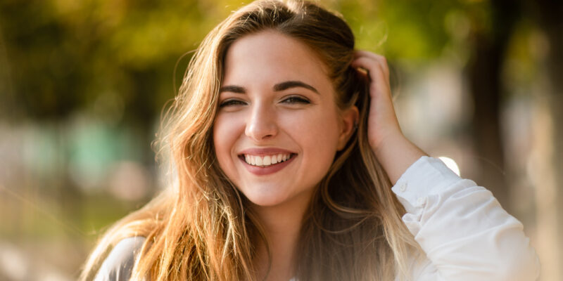 Portrait shot of teenage girl styling her hair