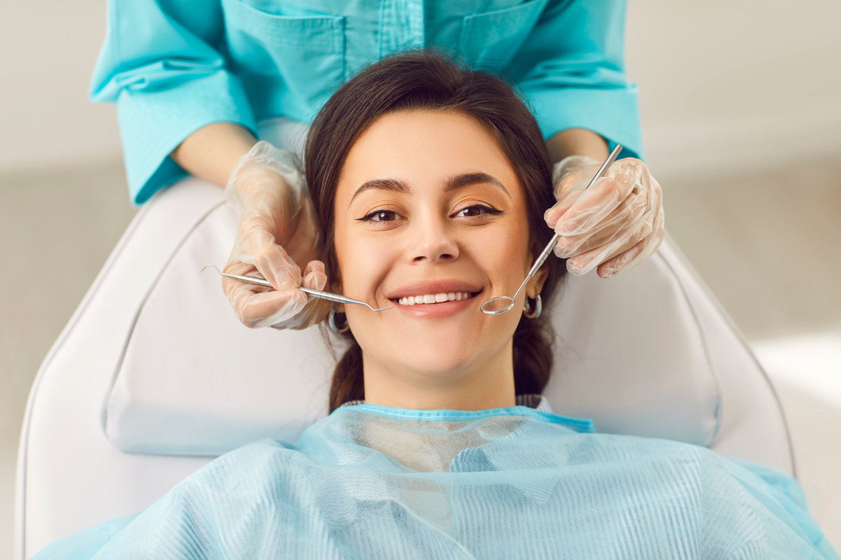 Dentist exam, teeth, gums, dental care exam, happy smiling woman healthy smile at doctor visit in clinic, demonstrating whitening teeth procedure result, satisfied with stomatology clinic service