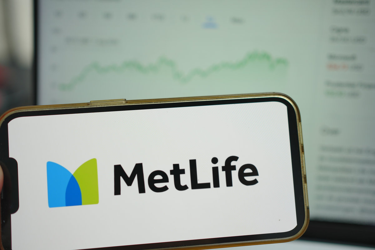 Roosendaal, The Netherlands - August 05, 2025: A mobile phone displaying the company logo of Metlife, with a stock chart in the background.